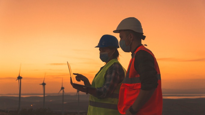 two engineers doing laptop inspections at the wind turbine field face picture id1279825782